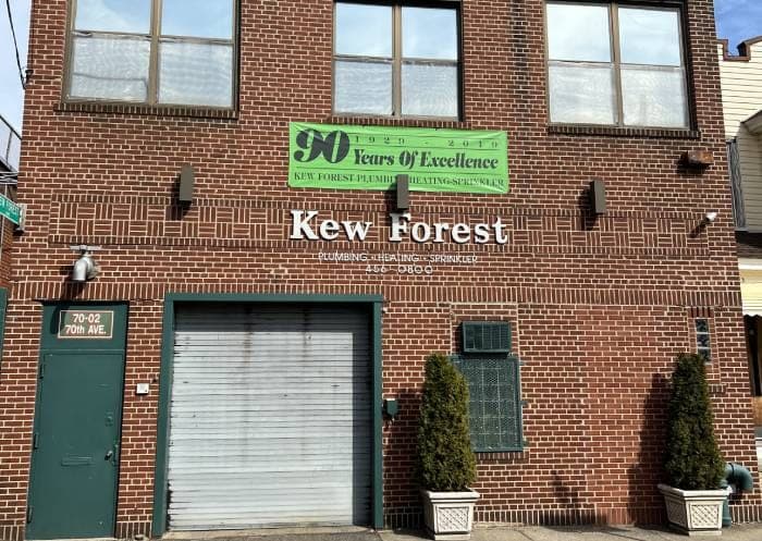 The Kew Forest building on 70th Avenue in Glendale, with its 90 Years of Excellence banner