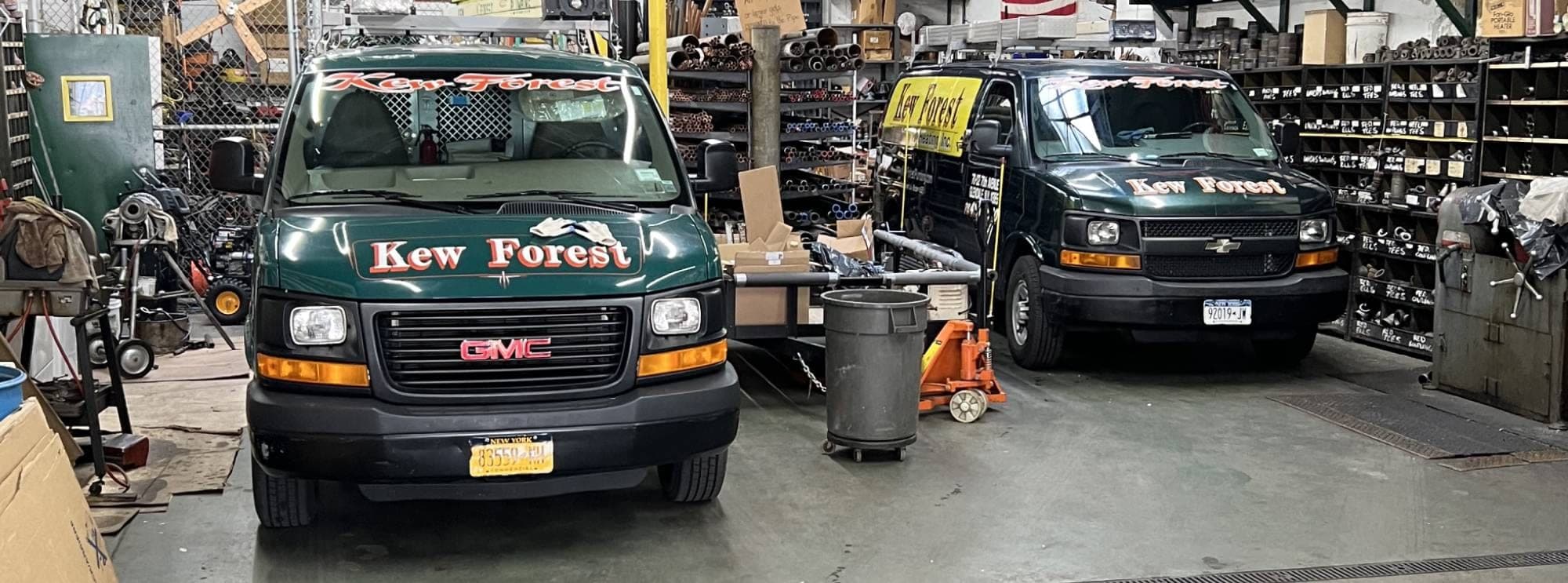 Kew Forest Plumbing & Heating service vans lined up in Glendale, Queens