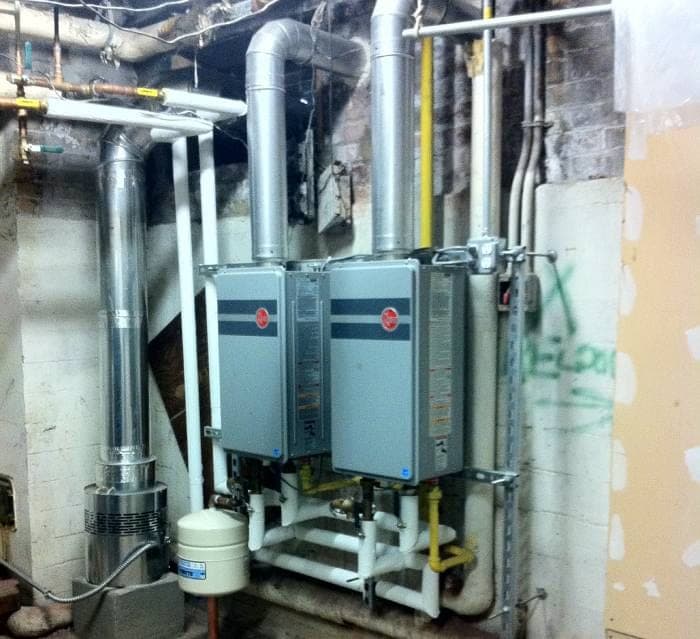 Twin tankless water heaters installed by Kew Forest