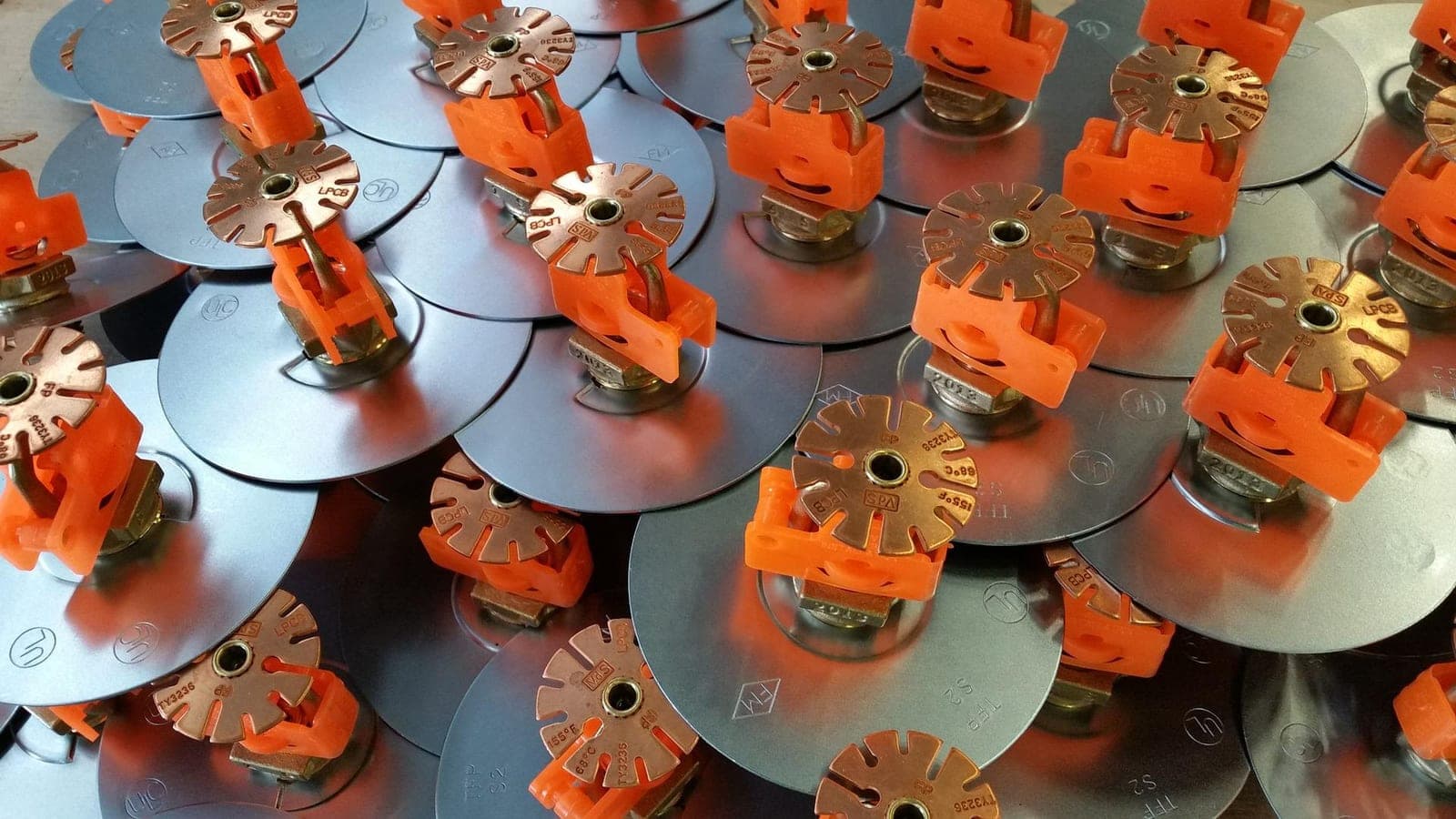 Rows of new fire sprinkler heads